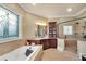 This well-appointed bathroom offers a tub, glass-enclosed shower, and a large window for natural light at 511 Baxter Way, Marietta, GA 30064