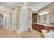 This primary bathroom has and sinks, vanity area, tub, and separate toilet room at 511 Baxter Way, Marietta, GA 30064