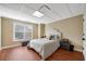 Comfortable bedroom features a cozy bed, storage chest, and natural light from the window, creating a relaxing retreat at 511 Baxter Way, Marietta, GA 30064
