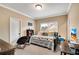 Bright bedroom featuring neutral walls, a comfy daybed, and a dedicated study area at 511 Baxter Way, Marietta, GA 30064