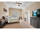 Relaxing bedroom showcasing a large bed, soft carpet, and abundant natural light at 511 Baxter Way, Marietta, GA 30064