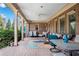 Spacious covered patio with comfortable seating, perfect for outdoor dining and relaxing year-round at 511 Baxter Way, Marietta, GA 30064