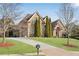 Stone and brick home with circular driveway and landscaping at 511 Baxter Way, Marietta, GA 30064