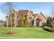 Brick house with stone accents, manicured lawn, and mature trees at 511 Baxter Way, Marietta, GA 30064