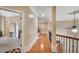 Bright hallway with hardwood floors, decorative lighting, and elegant trim, creating a welcoming atmosphere at 511 Baxter Way, Marietta, GA 30064