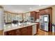 Island kitchen with granite countertops and stainless steel appliances at 511 Baxter Way, Marietta, GA 30064