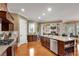 Open kitchen featuring granite countertops, stainless steel appliances, a large island, and access to the living area at 511 Baxter Way, Marietta, GA 30064