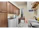 Well-equipped laundry room with built-in cabinets and modern washer and dryer at 511 Baxter Way, Marietta, GA 30064