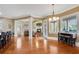 Bright open concept living area features hardwood floors, crown molding, and a fireplace with built-in shelving at 511 Baxter Way, Marietta, GA 30064