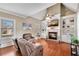 Inviting living room with a brick fireplace, built-in bookshelves, and hardwood floors at 511 Baxter Way, Marietta, GA 30064