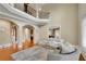 Spacious living room featuring hardwood floors, a loft space, and comfortable seating around a plush rug at 511 Baxter Way, Marietta, GA 30064