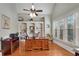 Bright home office features custom built-ins, hardwood floors, vaulted ceilings, and large windows at 511 Baxter Way, Marietta, GA 30064