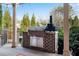 Outdoor kitchen featuring a grill, cabinets and counter space for outdoor dining at 511 Baxter Way, Marietta, GA 30064