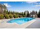 Gorgeous blue pool with concrete surround plus pool house, and beautifully maintained landscape at 511 Baxter Way, Marietta, GA 30064