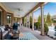 Lovely porch with seating area, ceiling fans, and elegant columns overlooking the outdoor space at 511 Baxter Way, Marietta, GA 30064