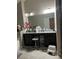 Bathroom boasts double vanity with granite countertop at 2398 Ticonic Rd, Lithonia, GA 30058