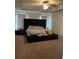 Spacious bedroom with large bed and plush carpet at 2398 Ticonic Rd, Lithonia, GA 30058
