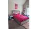 Charming bedroom with a queen-size bed and colorful decor at 2398 Ticonic Rd, Lithonia, GA 30058