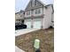 Two-story house with gray siding, two-car garage, and a landscaped front yard at 2398 Ticonic Rd, Lithonia, GA 30058