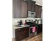 Kitchen with dark brown cabinets, granite countertops, and stainless steel appliances at 2398 Ticonic Rd, Lithonia, GA 30058