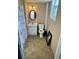 Small bathroom with white vanity, beige tile floor, and a shower at 6540 Old White Mill Rd, Fairburn, GA 30213