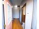 Inviting entryway with hardwood floors and a pink door at 744 Law Nw St, Atlanta, GA 30318