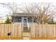 House with a wooden fence and a walkway to the front door at 744 Law Nw St, Atlanta, GA 30318