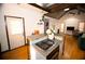 Open kitchen with island, gas cooktop and modern finishes at 744 Law Nw St, Atlanta, GA 30318