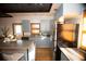 Modern kitchen with island, stainless steel appliances, and light blue cabinets at 744 Law Nw St, Atlanta, GA 30318