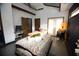 Main bedroom with king-size bed, access to backyard, and a sitting area at 744 Law Nw St, Atlanta, GA 30318