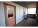 Screened porch with pink door and small table at 744 Law Nw St, Atlanta, GA 30318