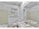 Bathroom with a white vanity, bathtub, and single sink at 5324 Joan Of Arc Pl, Atlanta, GA 30349