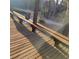 Sun-drenched wooden deck featuring built-in seating and scenic views of the surrounding landscape at 7 Quail Run, Decatur, GA 30035