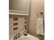 Bathroom featuring ceramic tile backsplash, vanity, mirror, towel ring, and plumbing at 7 Quail Run, Decatur, GA 30035