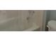 Bathroom with a bathtub and shower combination, offering essential bathing amenities at 7 Quail Run, Decatur, GA 30035