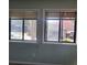 Bedroom featuring dual windows offering natural light and outdoor views at 7 Quail Run, Decatur, GA 30035