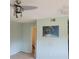 Bedroom with ceiling fan, light-green walls, and an open doorway, awaiting personalization at 7 Quail Run, Decatur, GA 30035