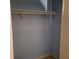 Empty closet with one shelf and bi-fold louvered doors at 7 Quail Run, Decatur, GA 30035