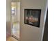 Hallway view showcasing a framed art piece and a glimpse into a room with natural light at 7 Quail Run, Decatur, GA 30035