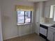 Kitchen featuring a sink under a window and classic white cabinetry at 7 Quail Run, Decatur, GA 30035