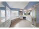 Elegant bathroom with a corner bathtub, double vanity, and stained-glass window at 879 Ector Chase Nw, Kennesaw, GA 30152