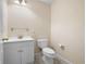 Clean bathroom with single sink and toilet at 879 Ector Chase Nw, Kennesaw, GA 30152