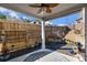 Inviting covered patio with a ceiling fan, stylish rug and peaceful water fountain at 202 Bryon Ln, Acworth, GA 30102