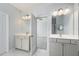 Bright bathroom with double vanities, modern fixtures, and a doorway leading to the bedroom at 202 Bryon Ln, Acworth, GA 30102