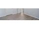 A neutral bedroom boasts light gray walls, white doors, and stylish wood-look flooring at 202 Bryon Ln, Acworth, GA 30102