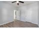 An unfurnished bedroom with light gray walls and floors, featuring an ensuite doorway and closet at 202 Bryon Ln, Acworth, GA 30102