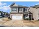 Inviting two-story home with a double garage, set on a well-maintained lawn at 202 Bryon Ln, Acworth, GA 30102