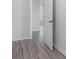 A hallway with painted gray walls and floors, featuring a door at 202 Bryon Ln, Acworth, GA 30102