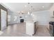 Open-concept kitchen featuring an island with granite countertops and stainless steel appliances at 202 Bryon Ln, Acworth, GA 30102