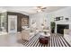 Bright living room boasts wood accent wall, cozy fireplace, and stylish striped rug at 202 Bryon Ln, Acworth, GA 30102